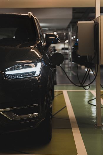 a car is plugged into a charging station